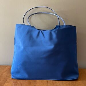 Polyester heavy-duty blue tote bag.